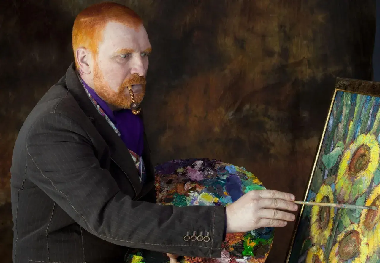 Mężczyzna z rudą brodą i fajką w ustach, malujący słoneczniki. Ciekawe van gogh ciekawostki o jego życiu i sztuce.